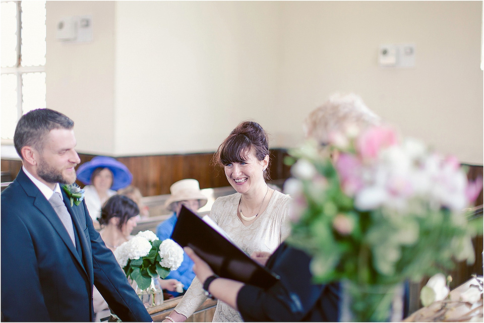 The bride wears a 1930s original vintage wedding gown for her village hall wedding in Scotland. Photography by Michelle Turnbull.