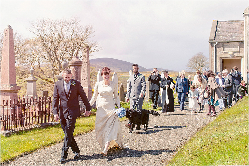 The bride wears a 1930s original vintage wedding gown for her village hall wedding in Scotland. Photography by Michelle Turnbull.