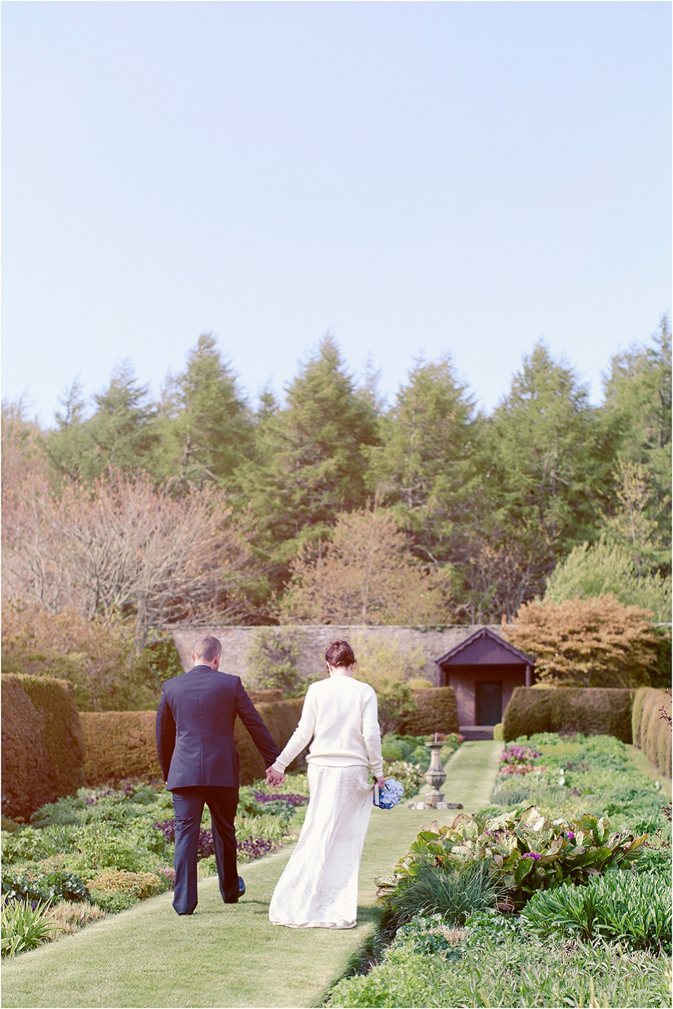 The bride wears a 1930s original vintage wedding gown for her village hall wedding in Scotland. Photography by Michelle Turnbull.