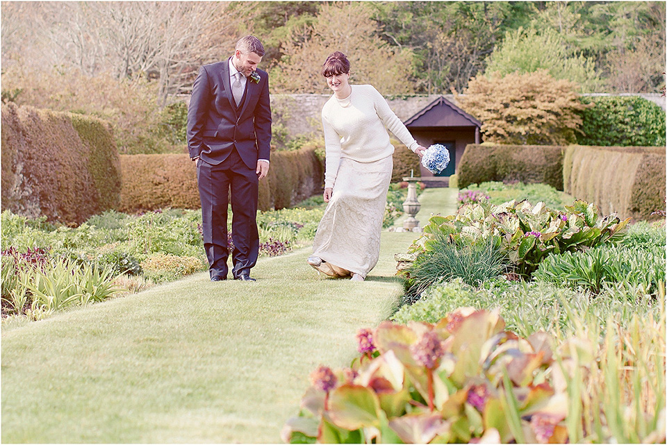 The bride wears a 1930s original vintage wedding gown for her village hall wedding in Scotland. Photography by Michelle Turnbull.