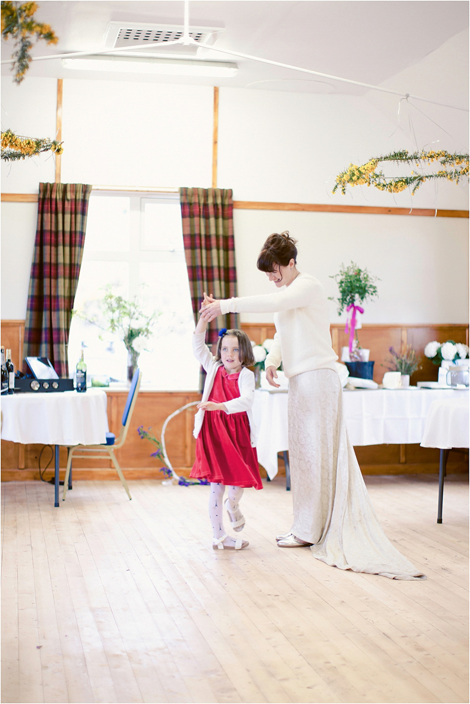 The bride wears a 1930s original vintage wedding gown for her village hall wedding in Scotland. Photography by Michelle Turnbull.