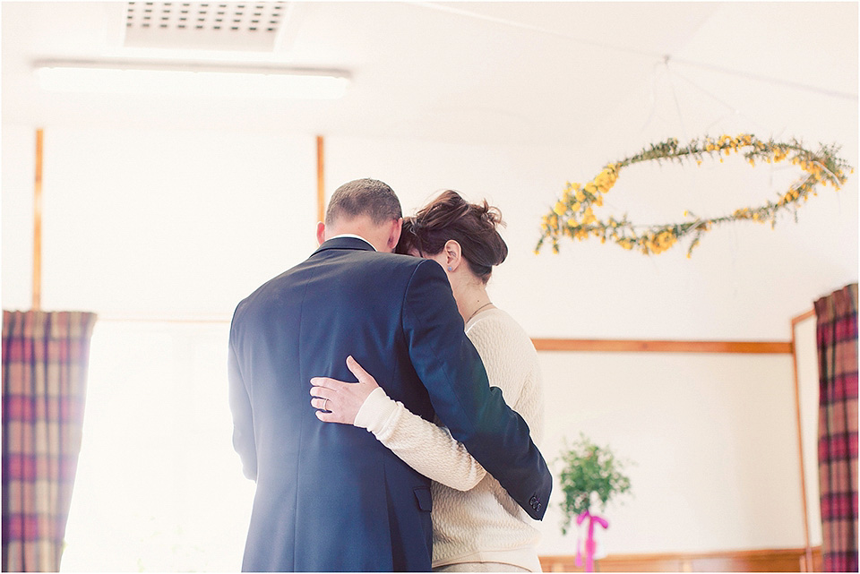 The bride wears a 1930s original vintage wedding gown for her village hall wedding in Scotland. Photography by Michelle Turnbull.