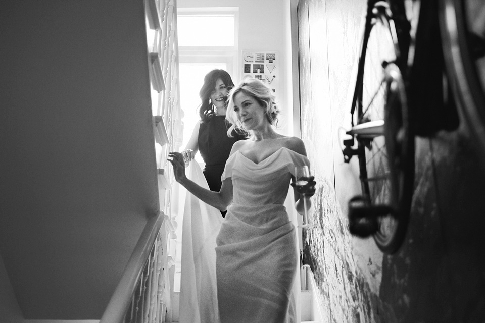 The bride wears Vivienne Westwood and Gold Rupert Sanderson shoes for her wedding at The Asylum in Peckham, London. Photography by David Jenkins.