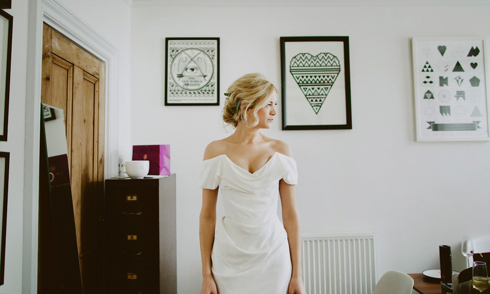 The bride wears Vivienne Westwood and Gold Rupert Sanderson shoes for her wedding at The Asylum in Peckham, London. Photography by David Jenkins.