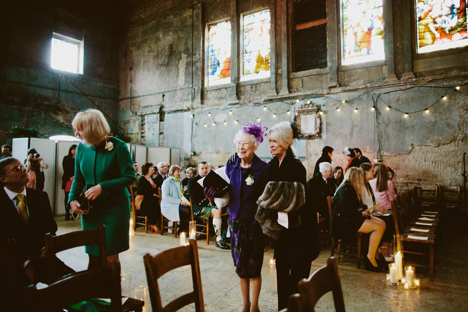 The bride wears Vivienne Westwood and Gold Rupert Sanderson shoes for her wedding at The Asylum in Peckham, London. Photography by David Jenkins.