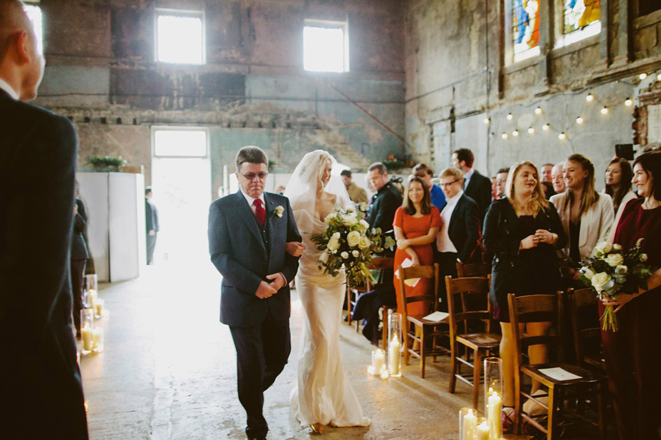 The bride wears Vivienne Westwood and Gold Rupert Sanderson shoes for her wedding at The Asylum in Peckham, London. Photography by David Jenkins.