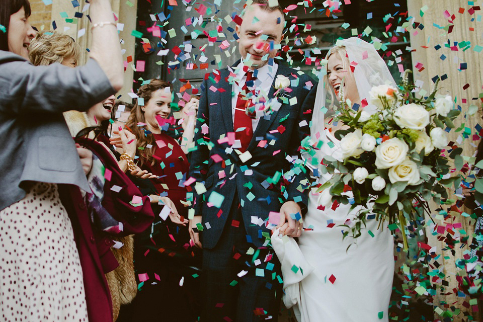 The bride wears Vivienne Westwood and Gold Rupert Sanderson shoes for her wedding at The Asylum in Peckham, London. Photography by David Jenkins.