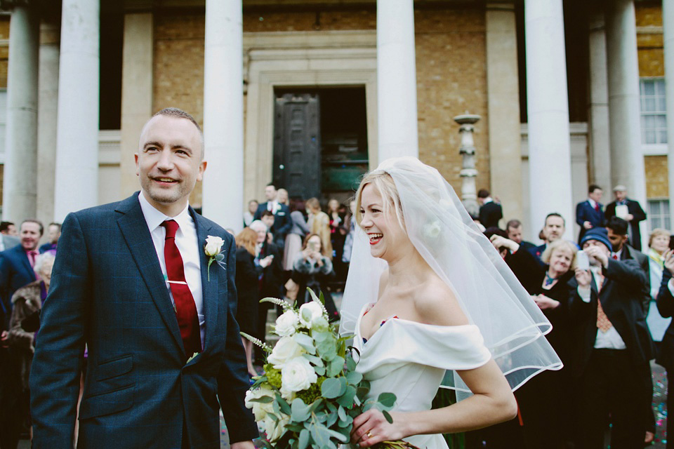 The bride wears Vivienne Westwood and Gold Rupert Sanderson shoes for her wedding at The Asylum in Peckham, London. Photography by David Jenkins.