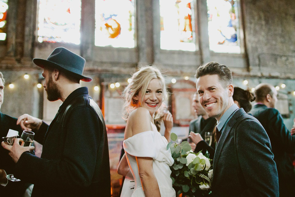 The bride wears Vivienne Westwood and Gold Rupert Sanderson shoes for her wedding at The Asylum in Peckham, London. Photography by David Jenkins.