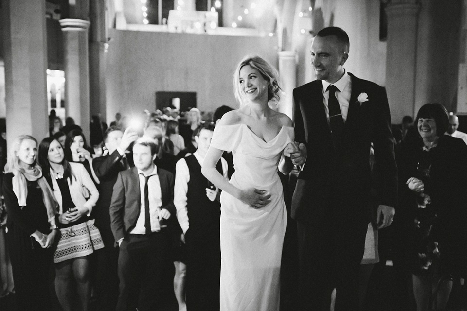 The bride wears Vivienne Westwood and Gold Rupert Sanderson shoes for her wedding at The Asylum in Peckham, London. Photography by David Jenkins.