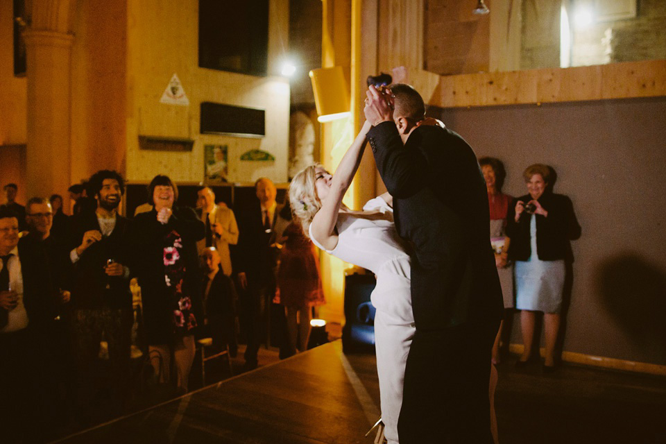 The bride wears Vivienne Westwood and Gold Rupert Sanderson shoes for her wedding at The Asylum in Peckham, London. Photography by David Jenkins.