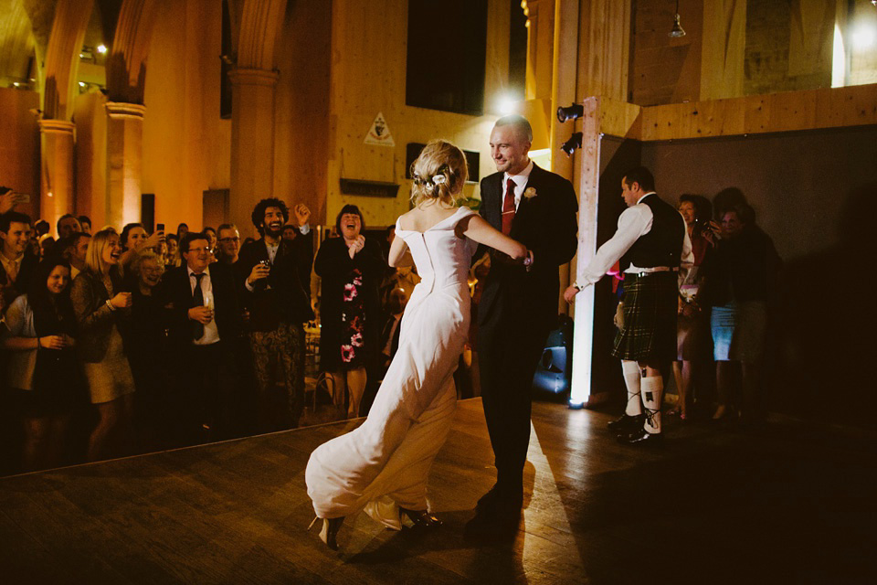 The bride wears Vivienne Westwood and Gold Rupert Sanderson shoes for her wedding at The Asylum in Peckham, London. Photography by David Jenkins.