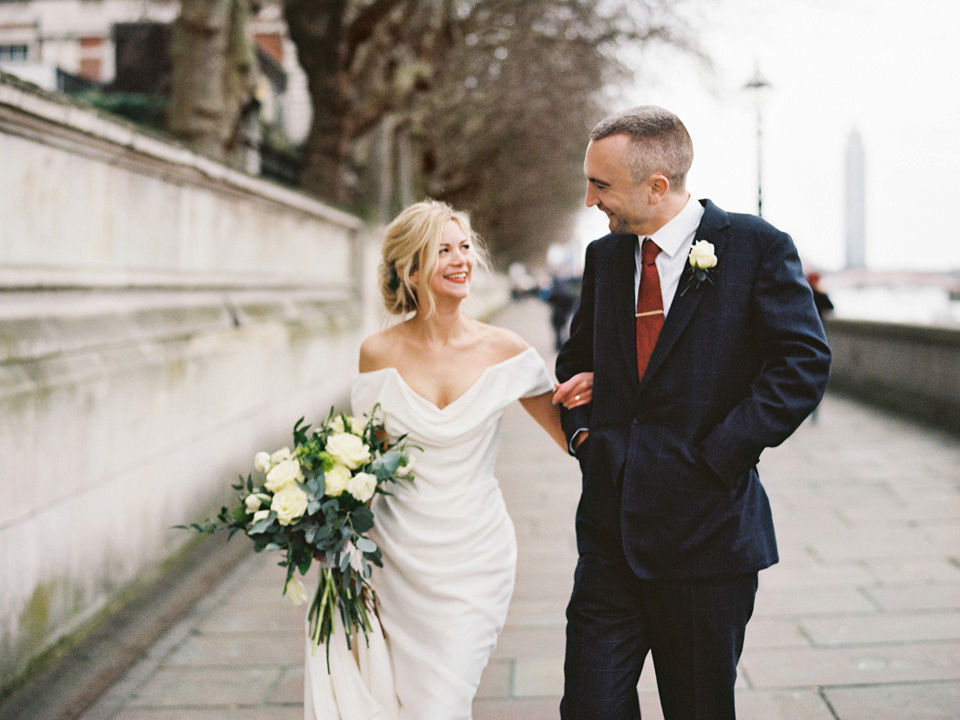 The bride wears Vivienne Westwood and Gold Rupert Sanderson shoes for her wedding at The Asylum in Peckham, London. Photography by David Jenkins.