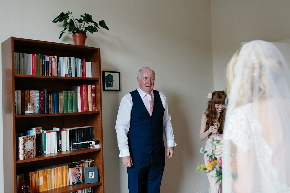 The bride wears a Rowanjoy dress and rose gold Twigs and Honey headpiece for her June wedding in Scotland. Photography by Caro Weiss.