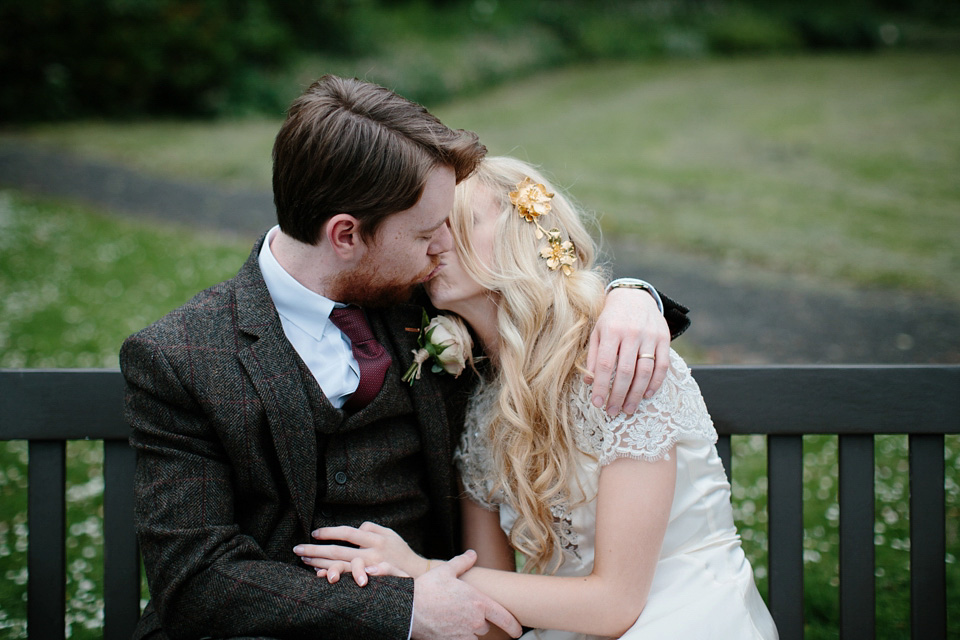 The bride wears a Rowanjoy dress and rose gold Twigs and Honey headpiece for her June wedding in Scotland. Photography by Caro Weiss.