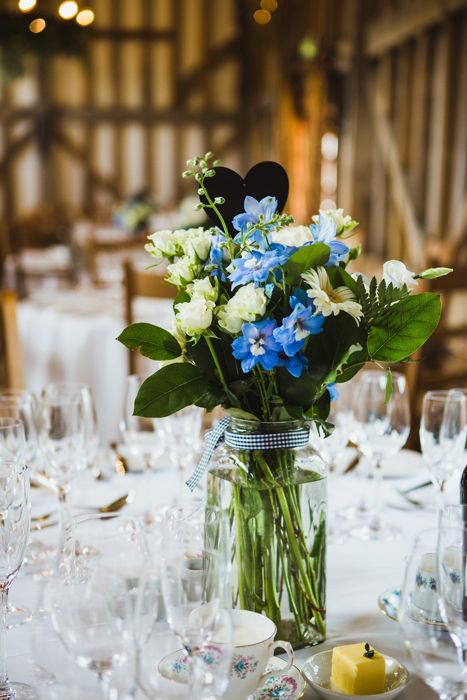 The bride wears a pale blue dress by Katya Katya Shehurina for her Spring, rural style wedding at Great Street Barn. Photography by Amy B.