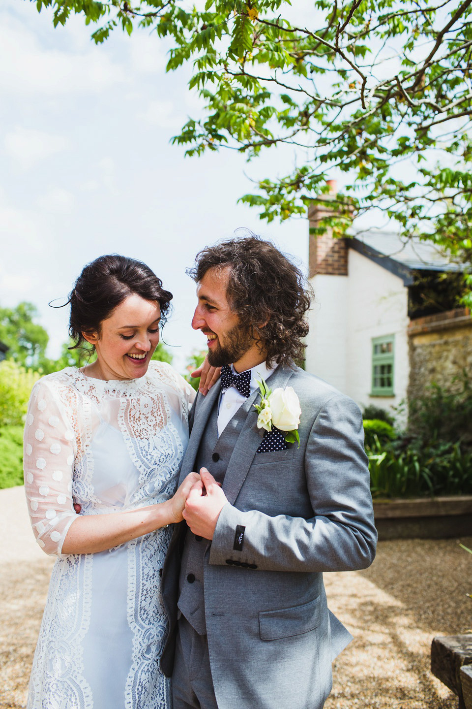 The bride wears a pale blue dress by Katya Katya Shehurina for her Spring, rural style wedding at Great Street Barn. Photography by Amy B.