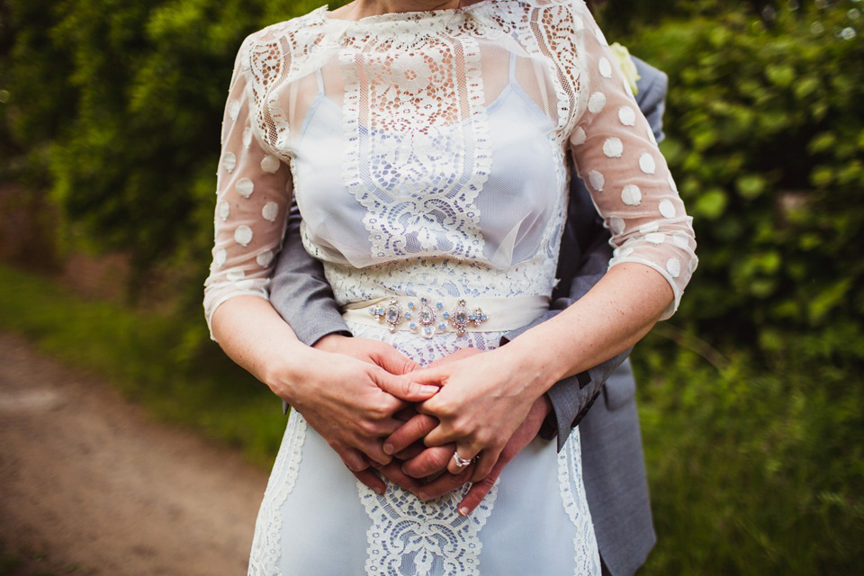 The bride wears a pale blue dress by Katya Katya Shehurina for her Spring, rural style wedding at Great Street Barn. Photography by Amy B.