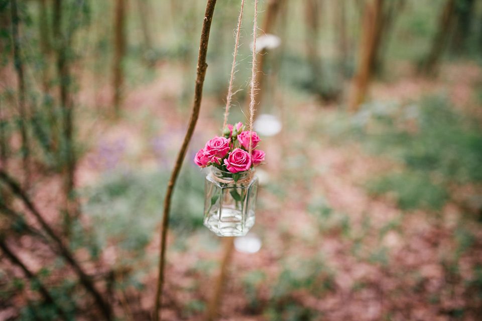 The bride wears a Sabina Motasem gown for her rustic, festival style wedding with glamping near the forrest. Photography by Joanna Nicole.