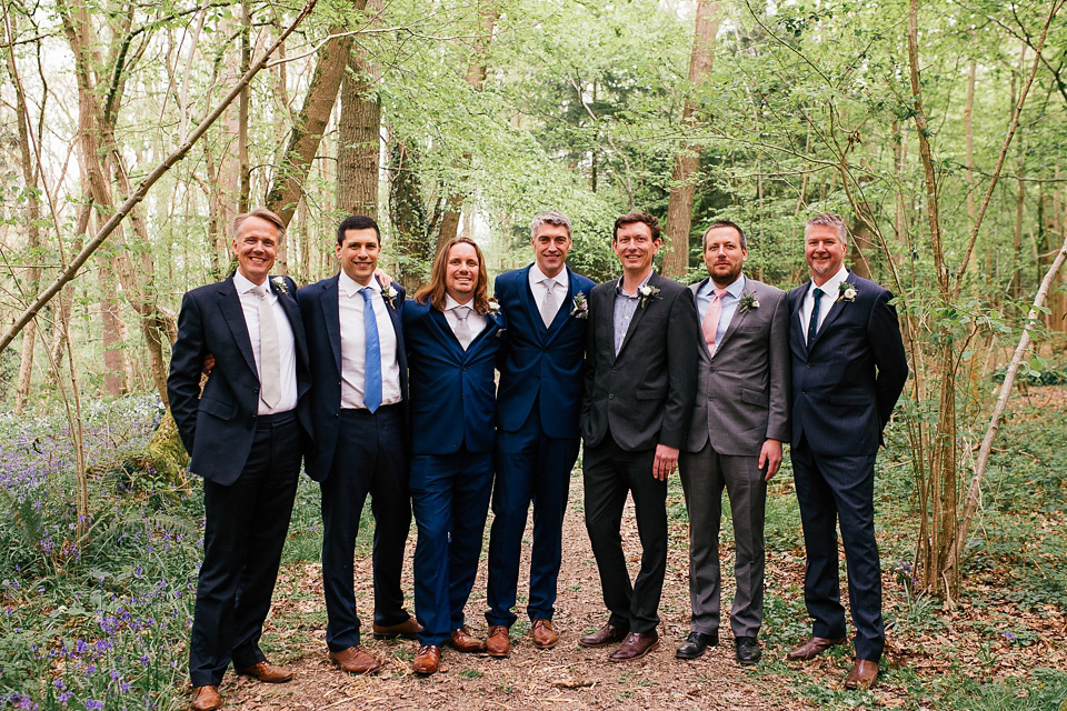 The bride wears a Sabina Motasem gown for her rustic, festival style wedding with glamping near the forrest. Photography by Joanna Nicole.