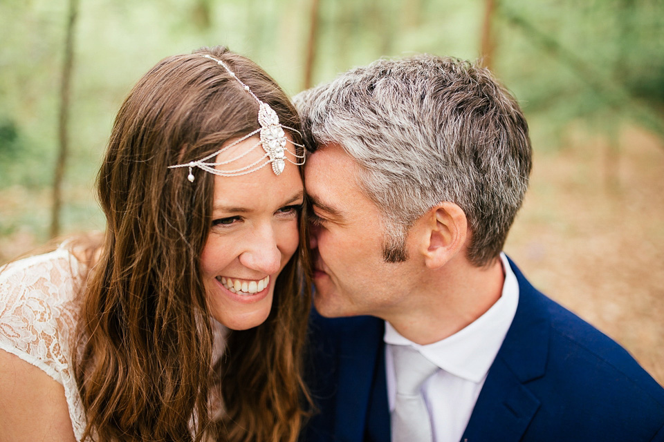 The bride wears a Sabina Motasem gown for her rustic, festival style wedding with glamping near the forrest. Photography by Joanna Nicole.