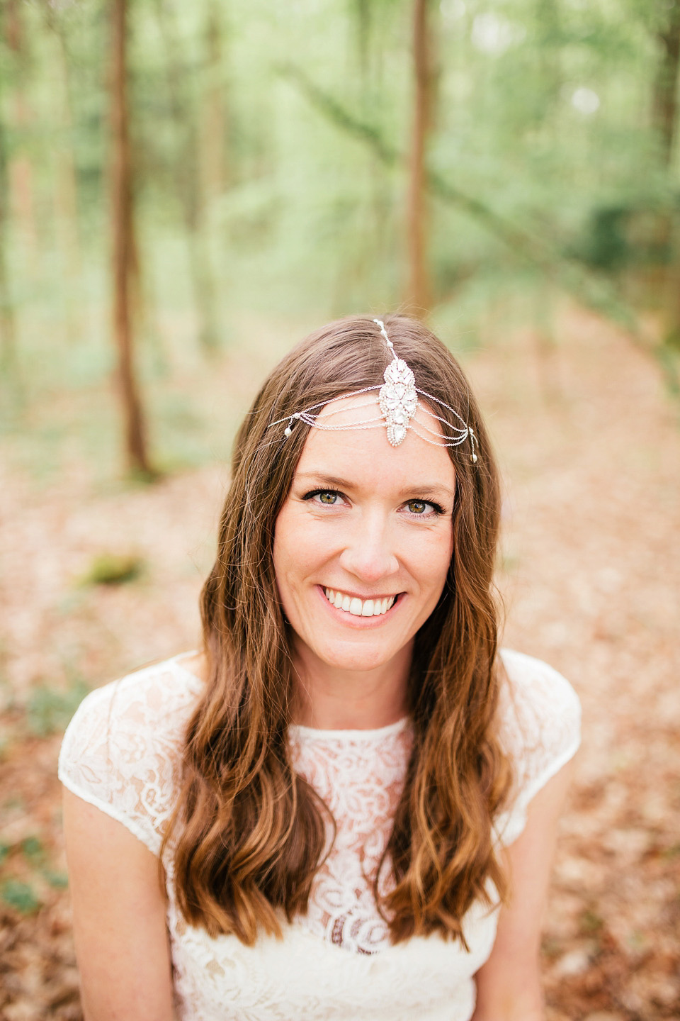 The bride wears a Sabina Motasem gown for her rustic, festival style wedding with glamping near the forrest. Photography by Joanna Nicole.