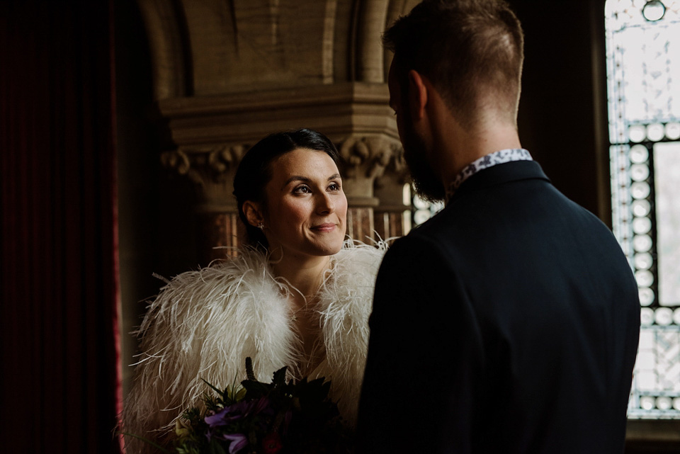 The bride wears a drop waist 1920s style wedding dress by Charlie Brear for her Manchester city wedding. Photography by Neil Thomas Douglas