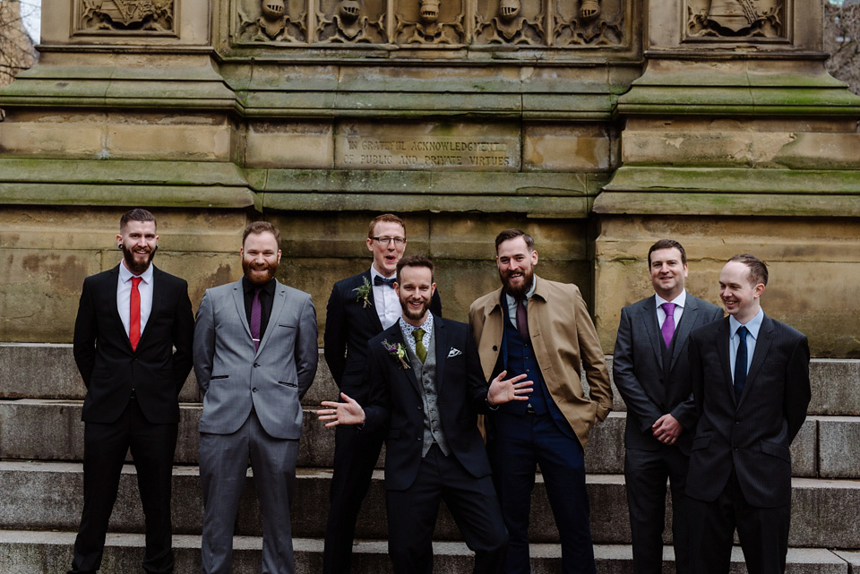 The bride wears a drop waist 1920s style wedding dress by Charlie Brear for her Manchester city wedding. Photography by Neil Thomas Douglas