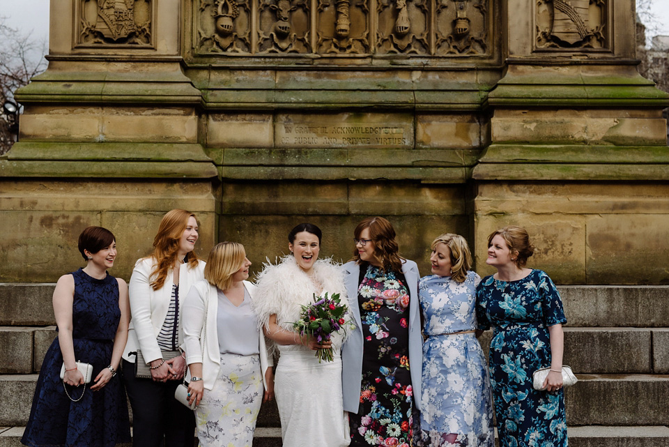 The bride wears a drop waist 1920s style wedding dress by Charlie Brear for her Manchester city wedding. Photography by Neil Thomas Douglas