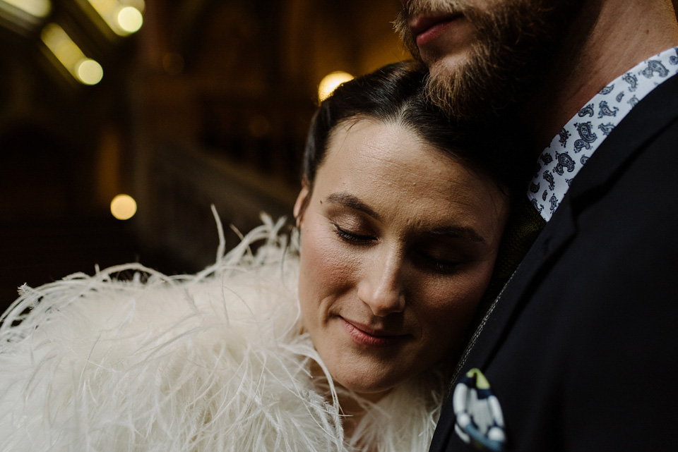 The bride wears a drop waist 1920s style wedding dress by Charlie Brear for her Manchester city wedding. Photography by Neil Thomas Douglas