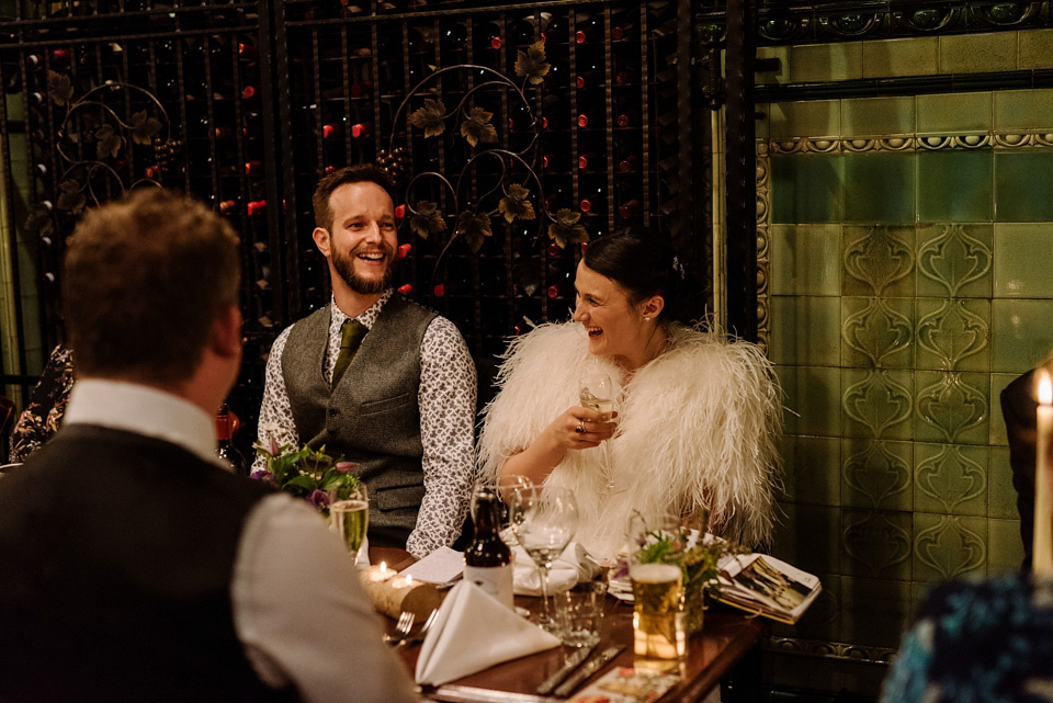 The bride wears a drop waist 1920s style wedding dress by Charlie Brear for her Manchester city wedding. Photography by Neil Thomas Douglas