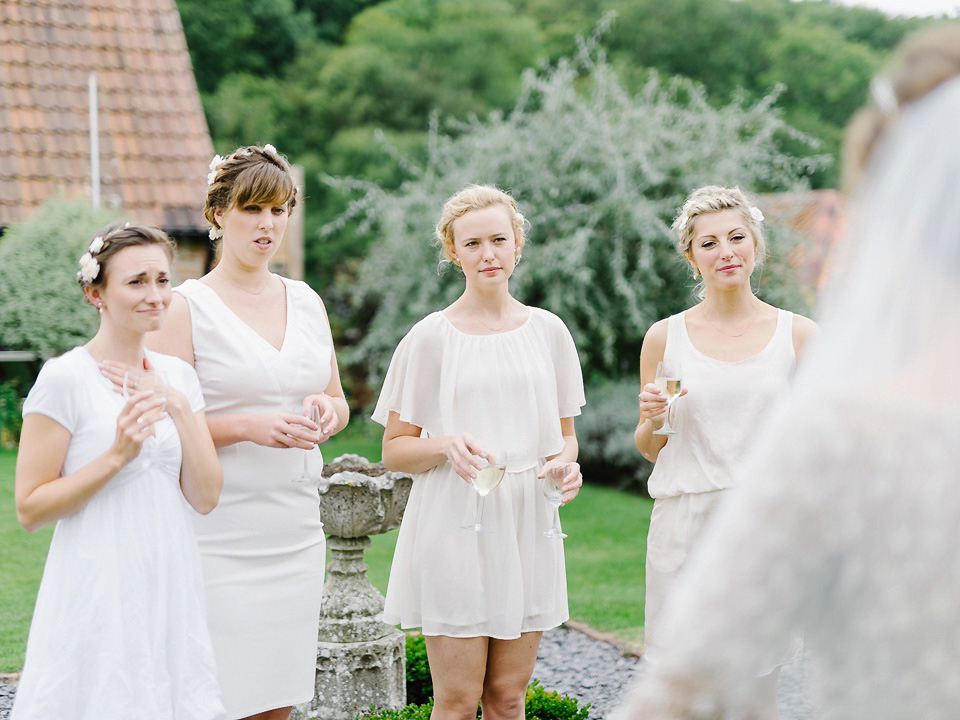 Bride Thea wears a Halfpenny London gown for her laid back dinner party wedding. Photography by John Barwood.