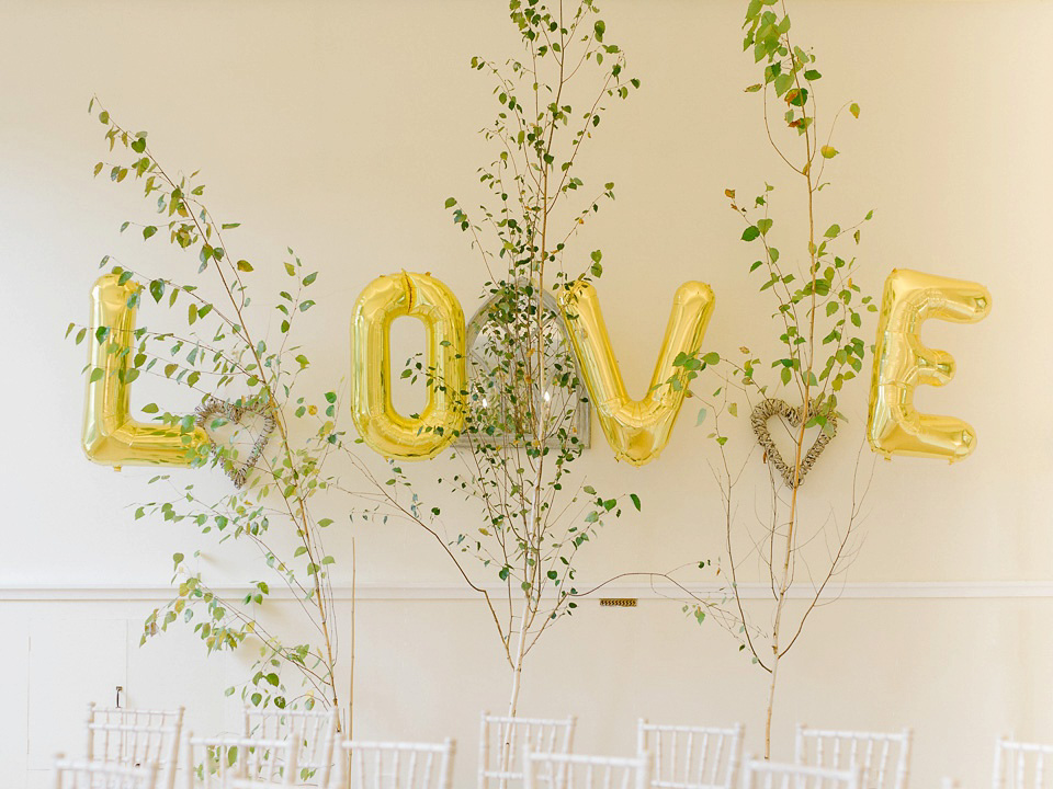 Bride Thea wears a Halfpenny London gown for her laid back dinner party wedding. Photography by John Barwood.