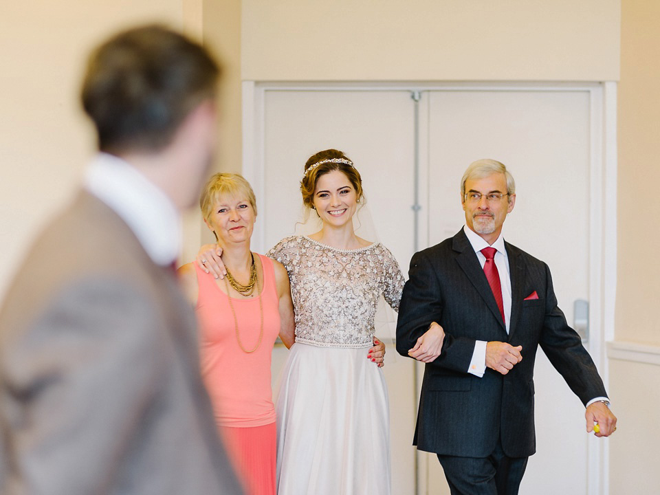 Bride Thea wears a Halfpenny London gown for her laid back dinner party wedding. Photography by John Barwood.