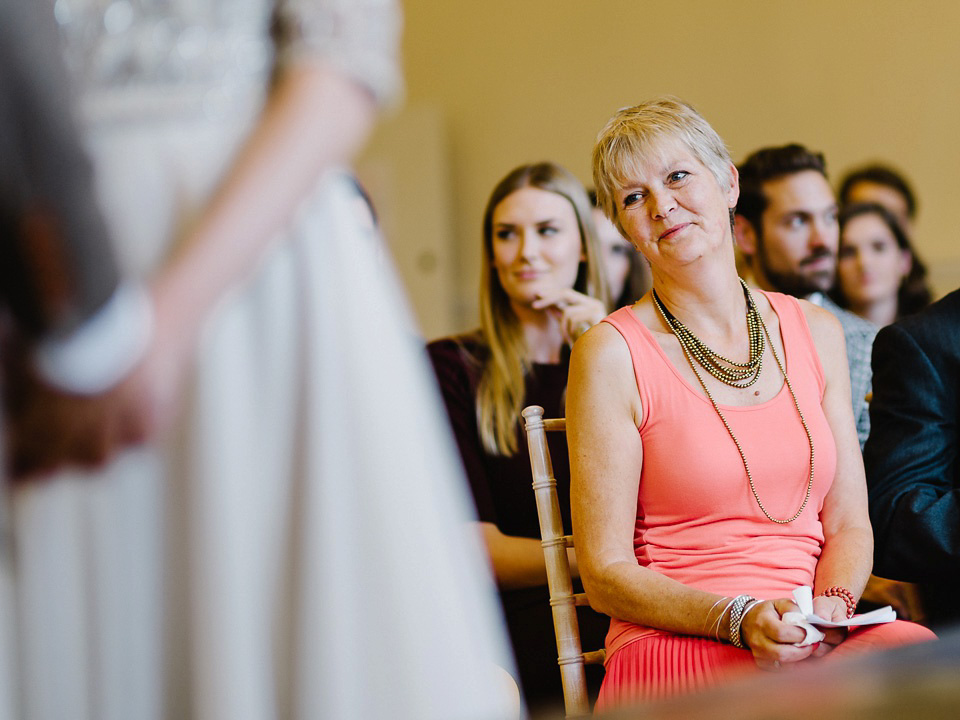 Bride Thea wears a Halfpenny London gown for her laid back dinner party wedding. Photography by John Barwood.