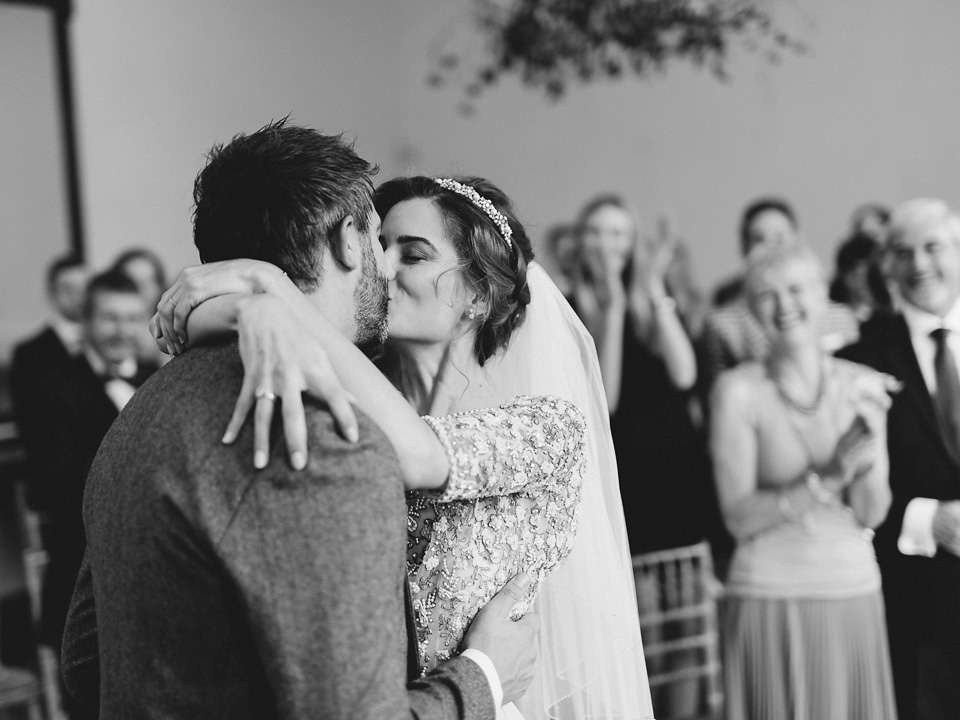 Bride Thea wears a Halfpenny London gown for her laid back dinner party wedding. Photography by John Barwood.