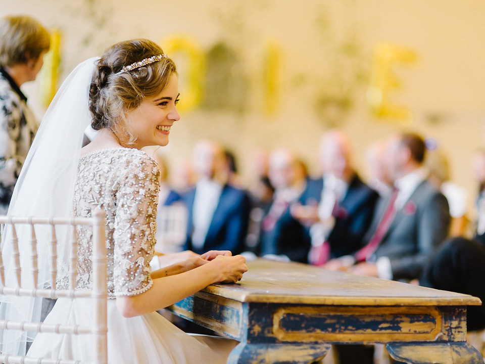 Bride Thea wears a Halfpenny London gown for her laid back dinner party wedding. Photography by John Barwood.