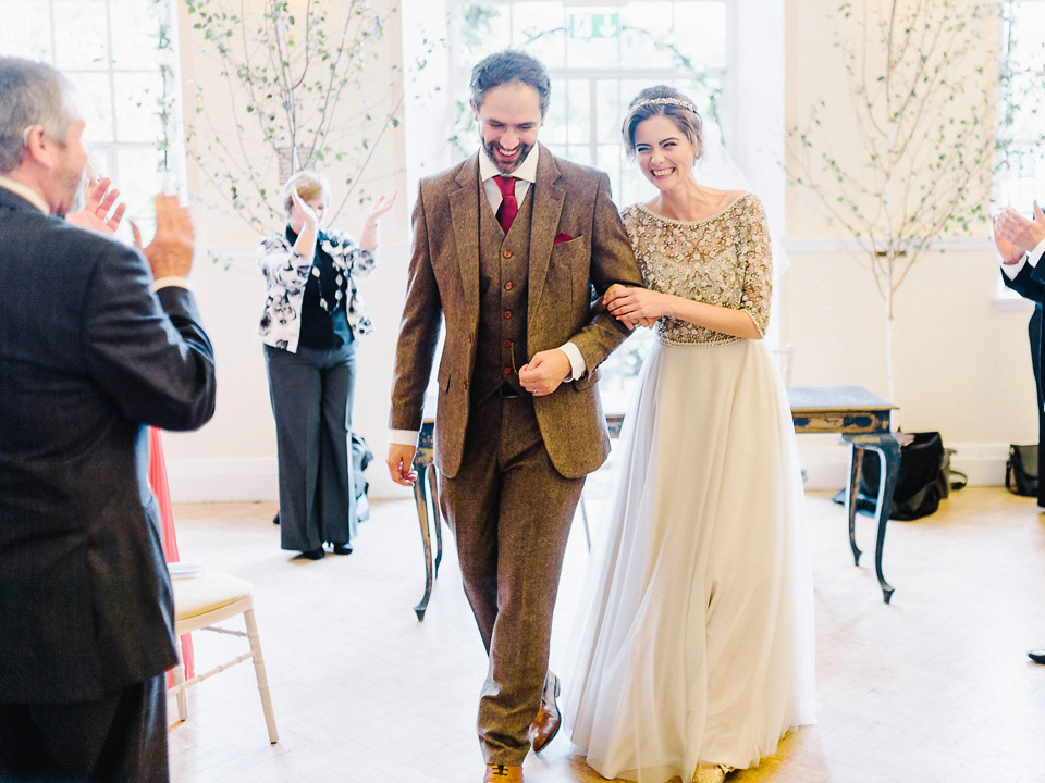 Bride Thea wears a Halfpenny London gown for her laid back dinner party wedding. Photography by John Barwood.