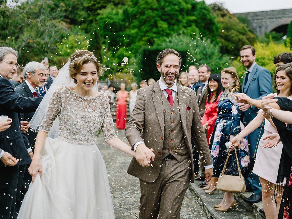 Bride Thea wears a Halfpenny London gown for her laid back dinner party wedding. Photography by John Barwood.