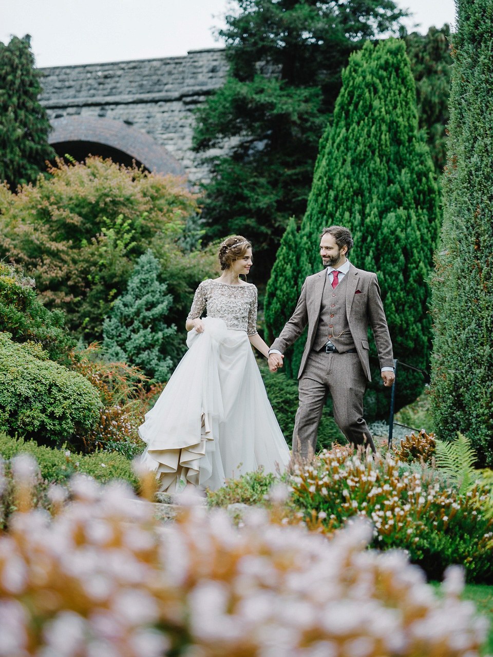 Bride Thea wears a Halfpenny London gown for her laid back dinner party wedding. Photography by John Barwood.