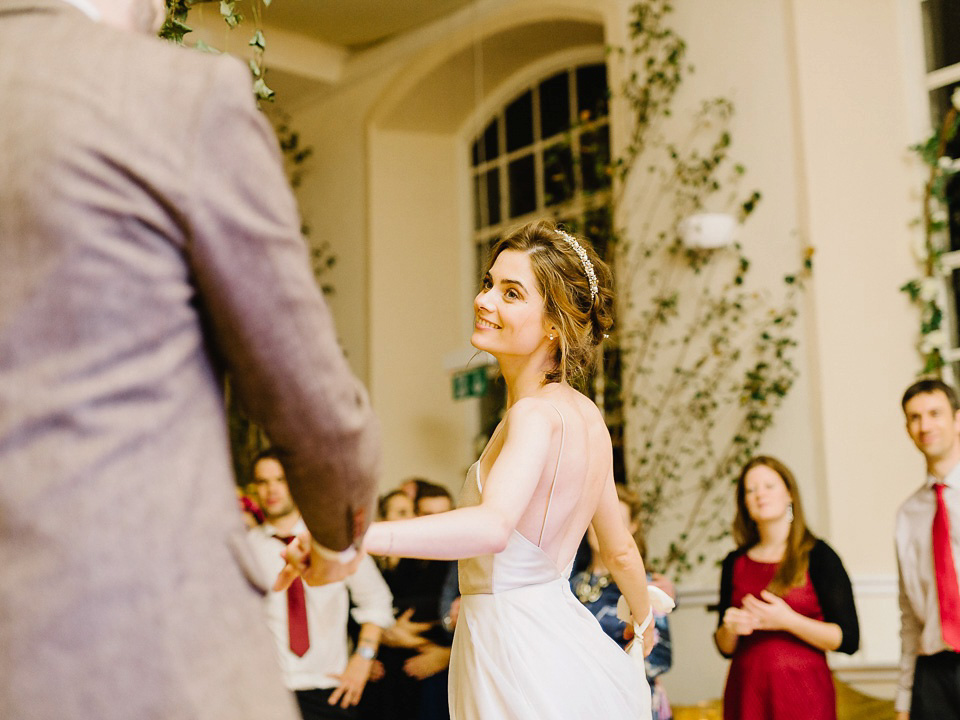 Bride Thea wears a Halfpenny London gown for her laid back dinner party wedding. Photography by John Barwood.