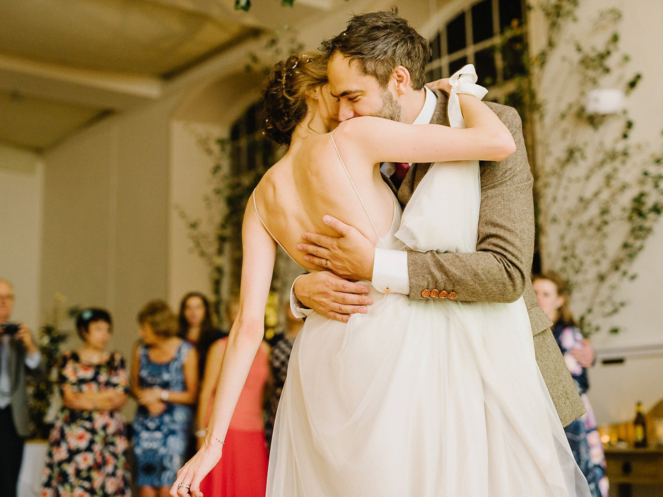 Bride Thea wears a Halfpenny London gown for her laid back dinner party wedding. Photography by John Barwood.