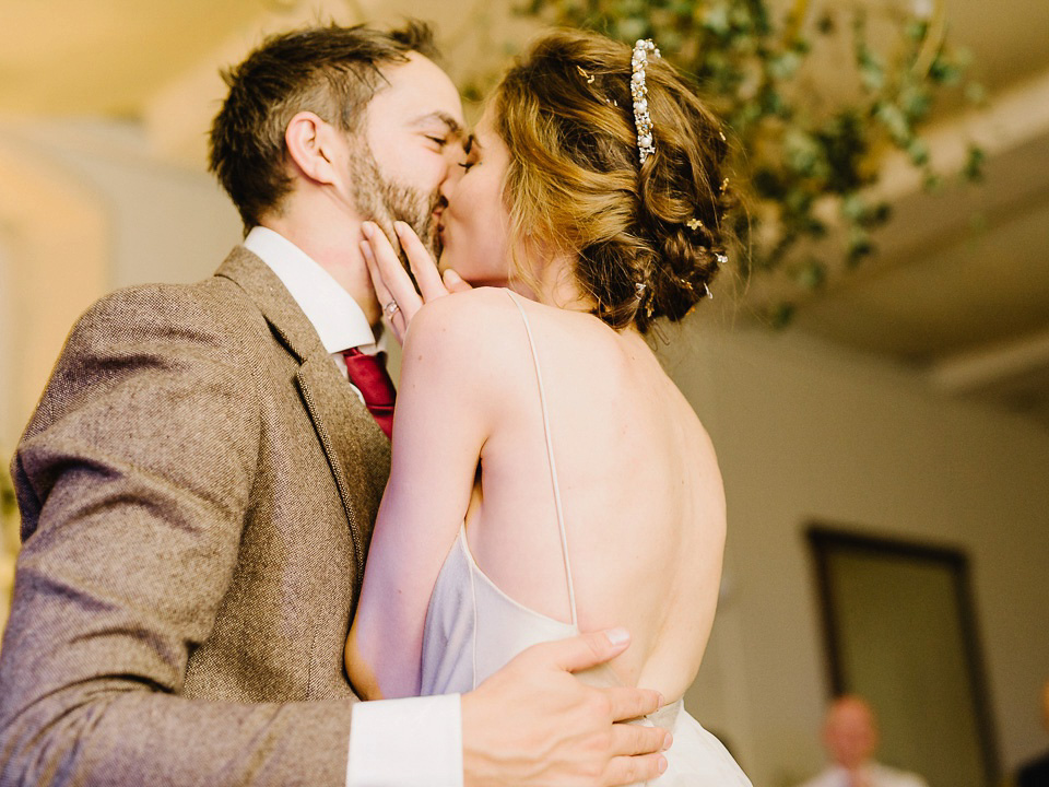 Bride Thea wears a Halfpenny London gown for her laid back dinner party wedding. Photography by John Barwood.