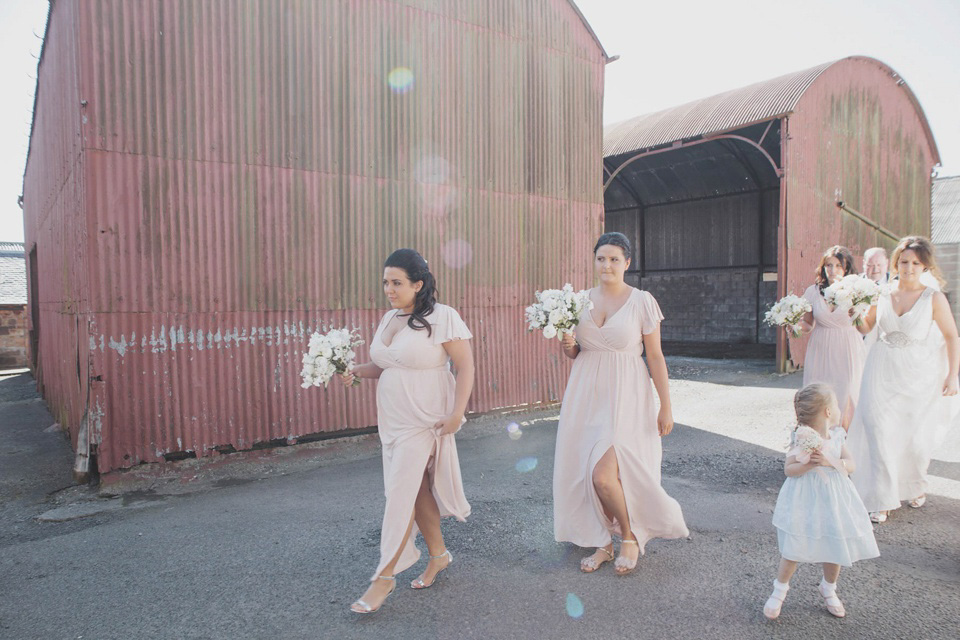 A grecian style gown by Jenny Packham for a rustic inspired Italian Scottish Humanist barn wedding. Images by Mirrorbox Photography.