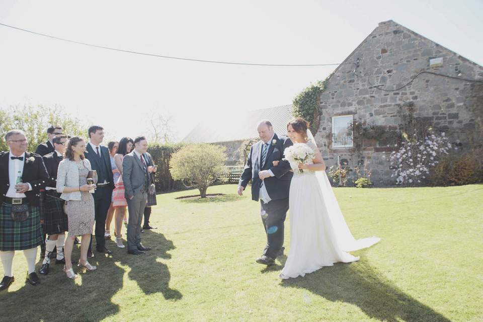 A grecian style gown by Jenny Packham for a rustic inspired Italian Scottish Humanist barn wedding. Images by Mirrorbox Photography.