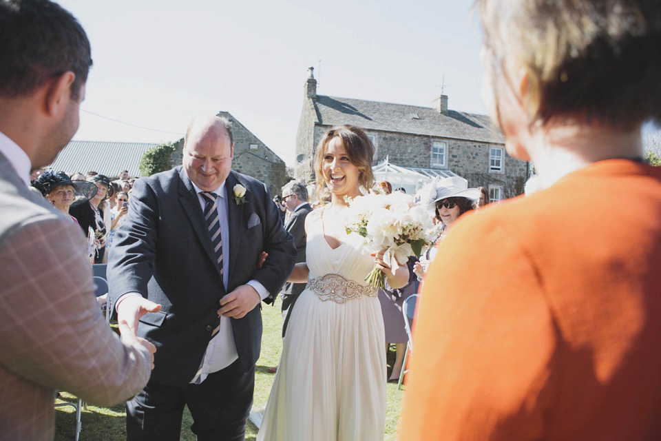 A grecian style gown by Jenny Packham for a rustic inspired Italian Scottish Humanist barn wedding. Images by Mirrorbox Photography.