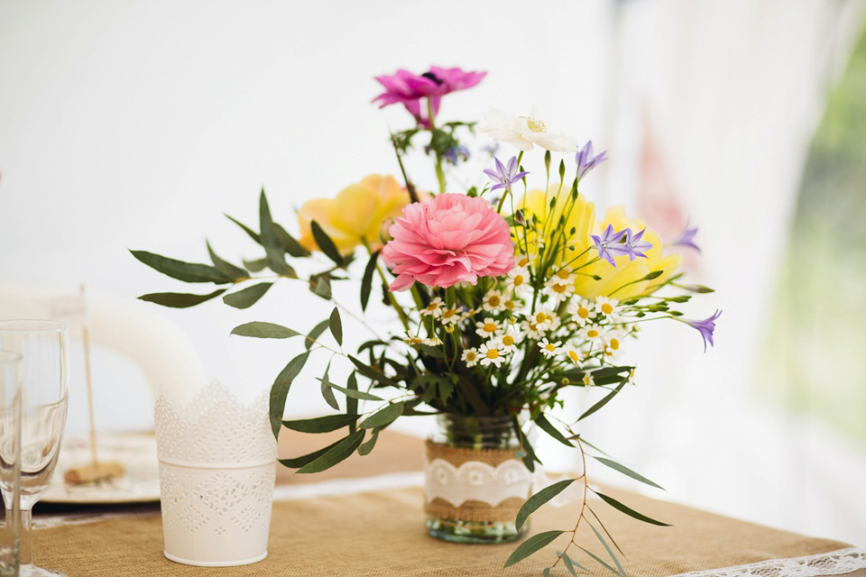 The bride wears a top and skirt for her charming orchard wedding. Photography by Cat Lane.