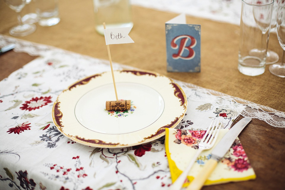 The bride wears a top and skirt for her charming orchard wedding. Photography by Cat Lane.