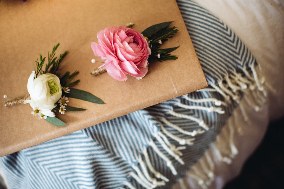 The bride wears a top and skirt for her charming orchard wedding. Photography by Cat Lane.