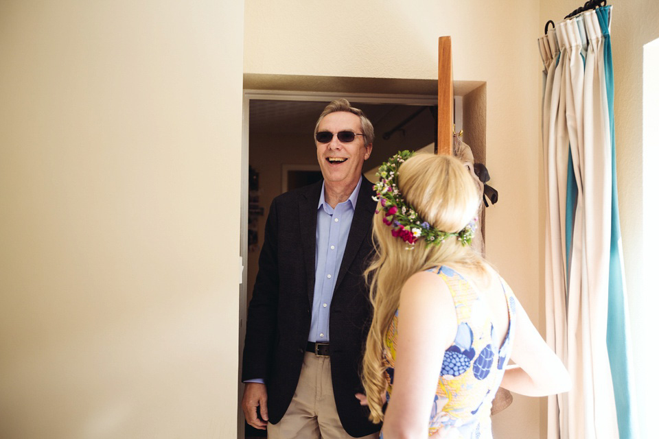 The bride wears a top and skirt for her charming orchard wedding. Photography by Cat Lane.